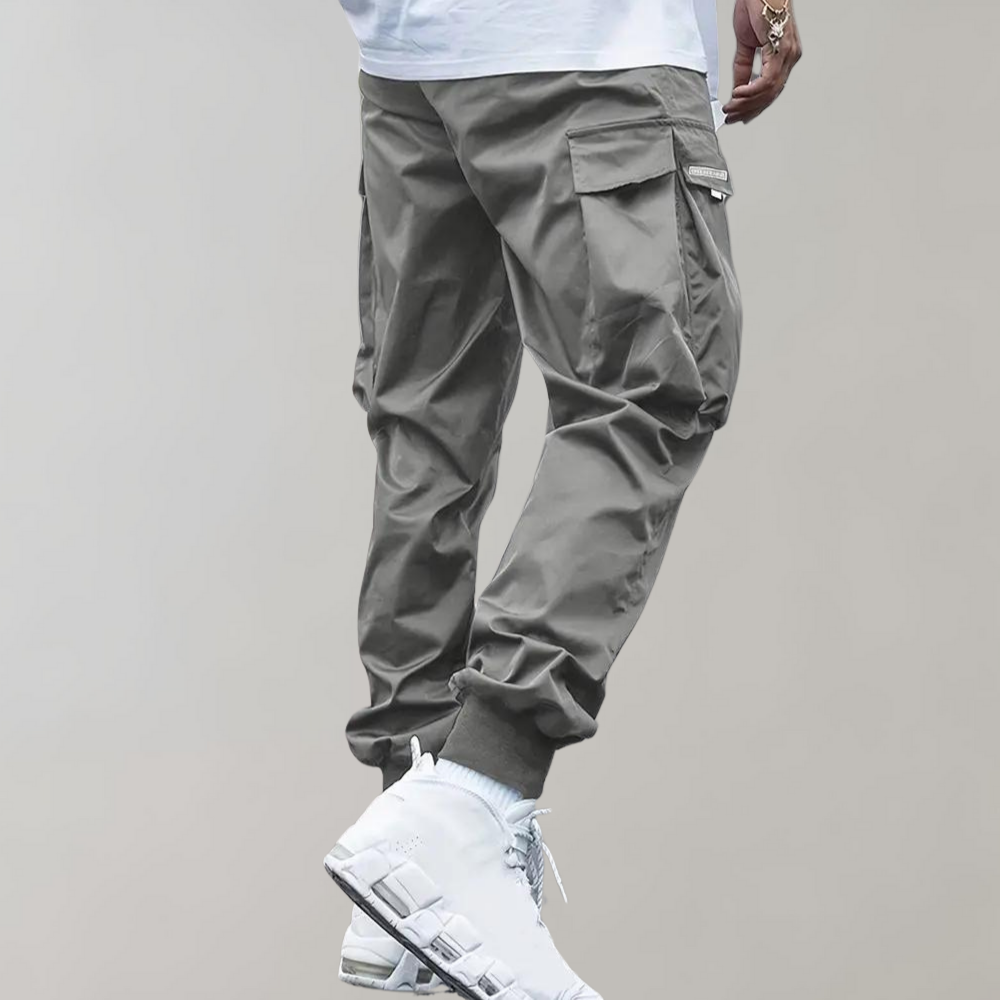 SVEA | Herren Cargo Jogginghose – Lila Streetwear-Hose mit Reißverschlusstaschen & Bündchen