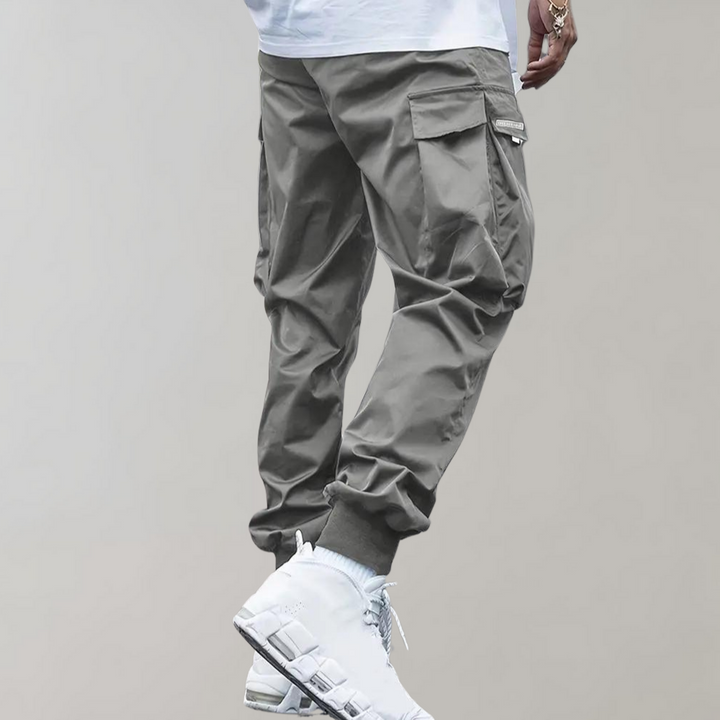 SVEA | Herren Cargo Jogginghose – Lila Streetwear-Hose mit Reißverschlusstaschen & Bündchen